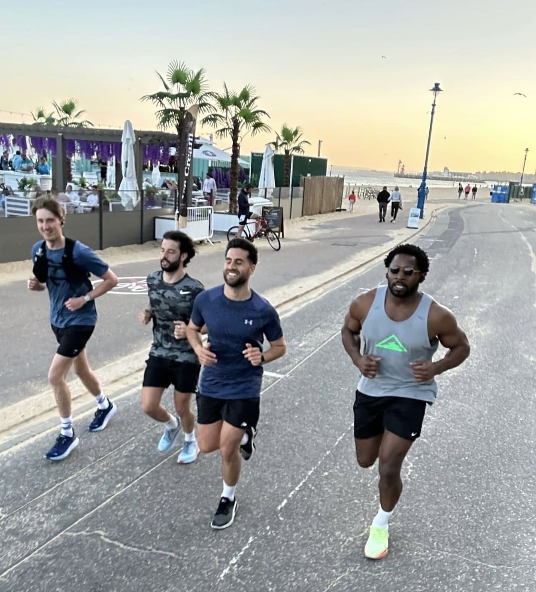 Team running along the beachfront