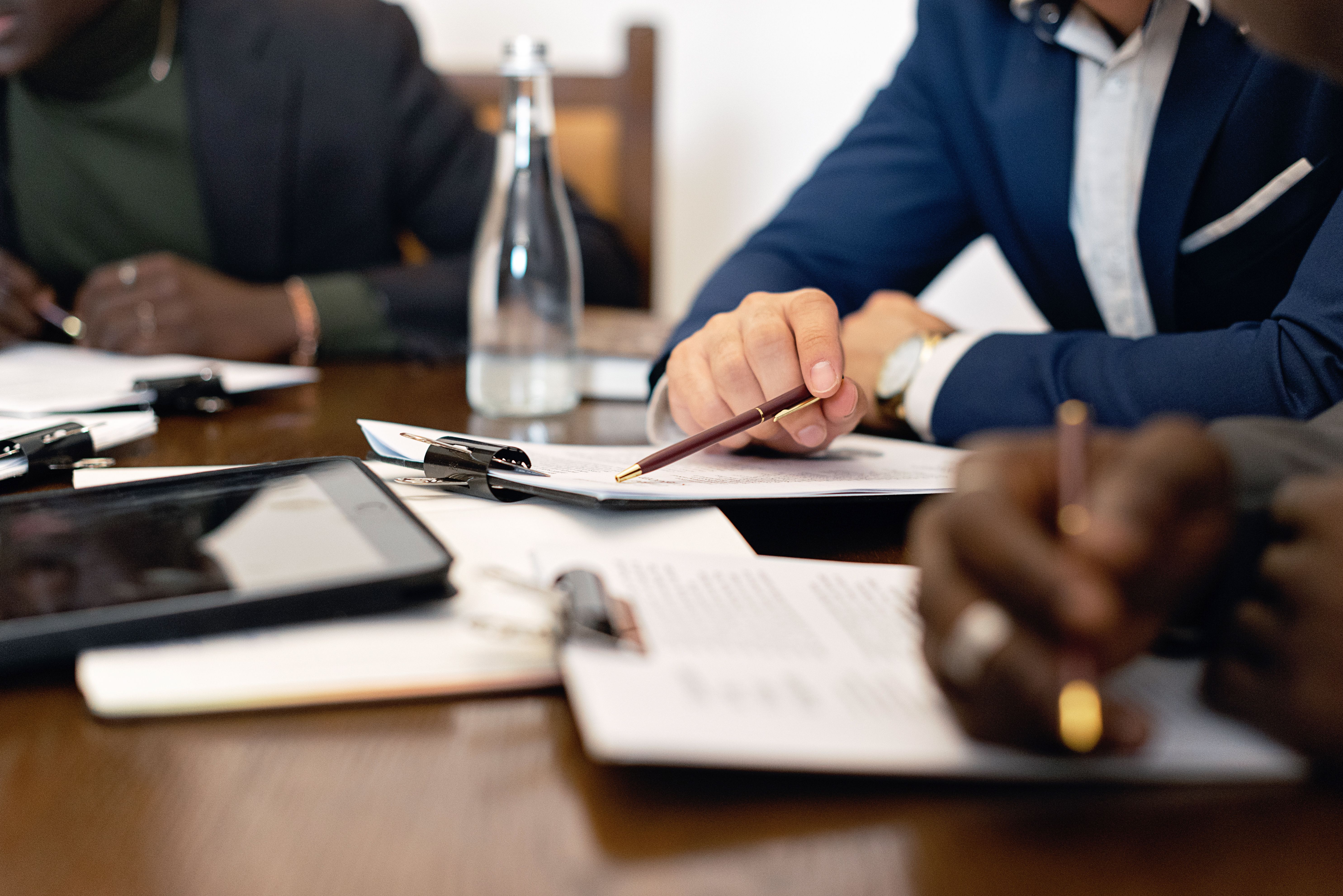 Business professionals collaborating around a meeting table