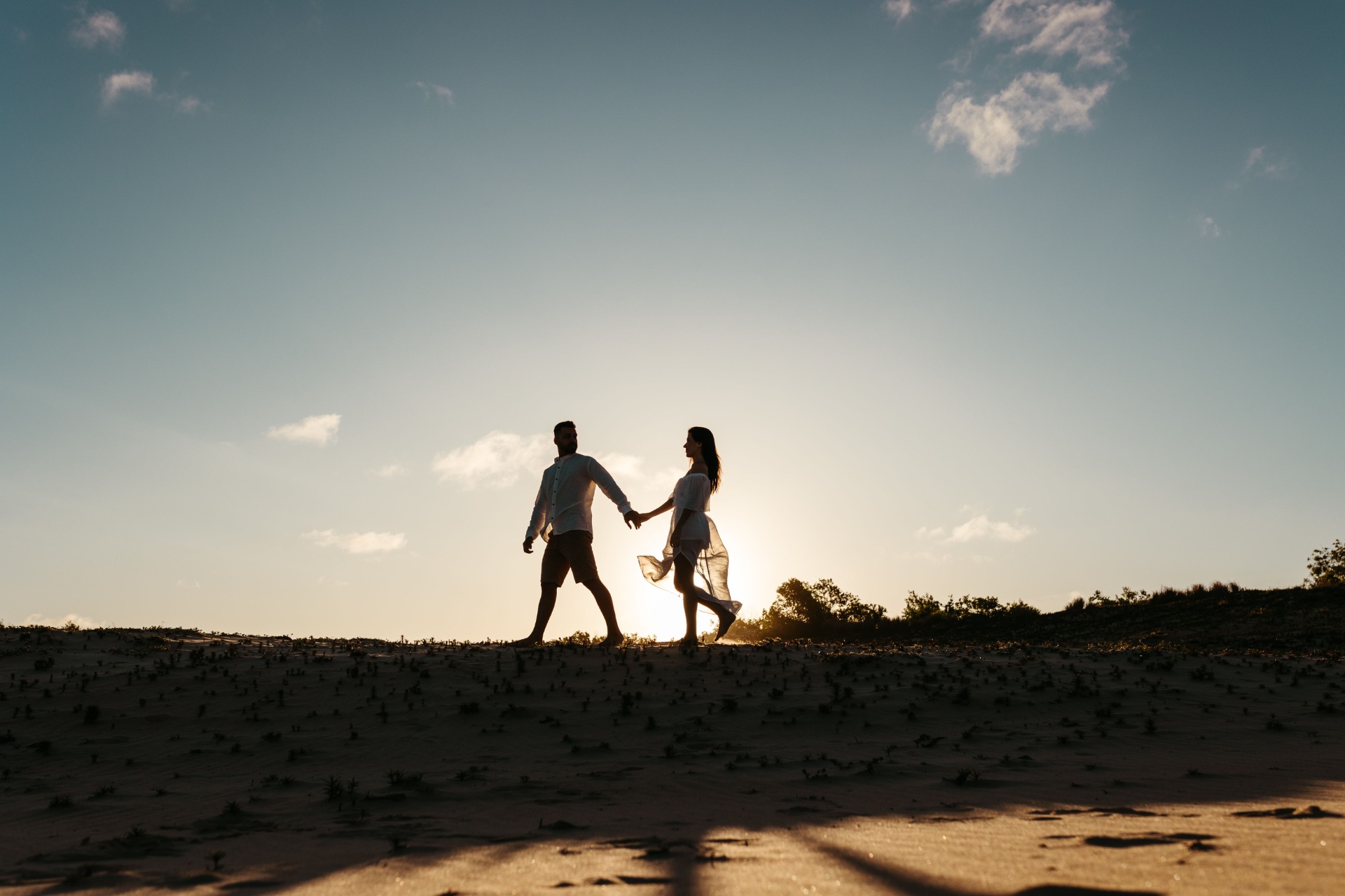 Couple walking together at sunset