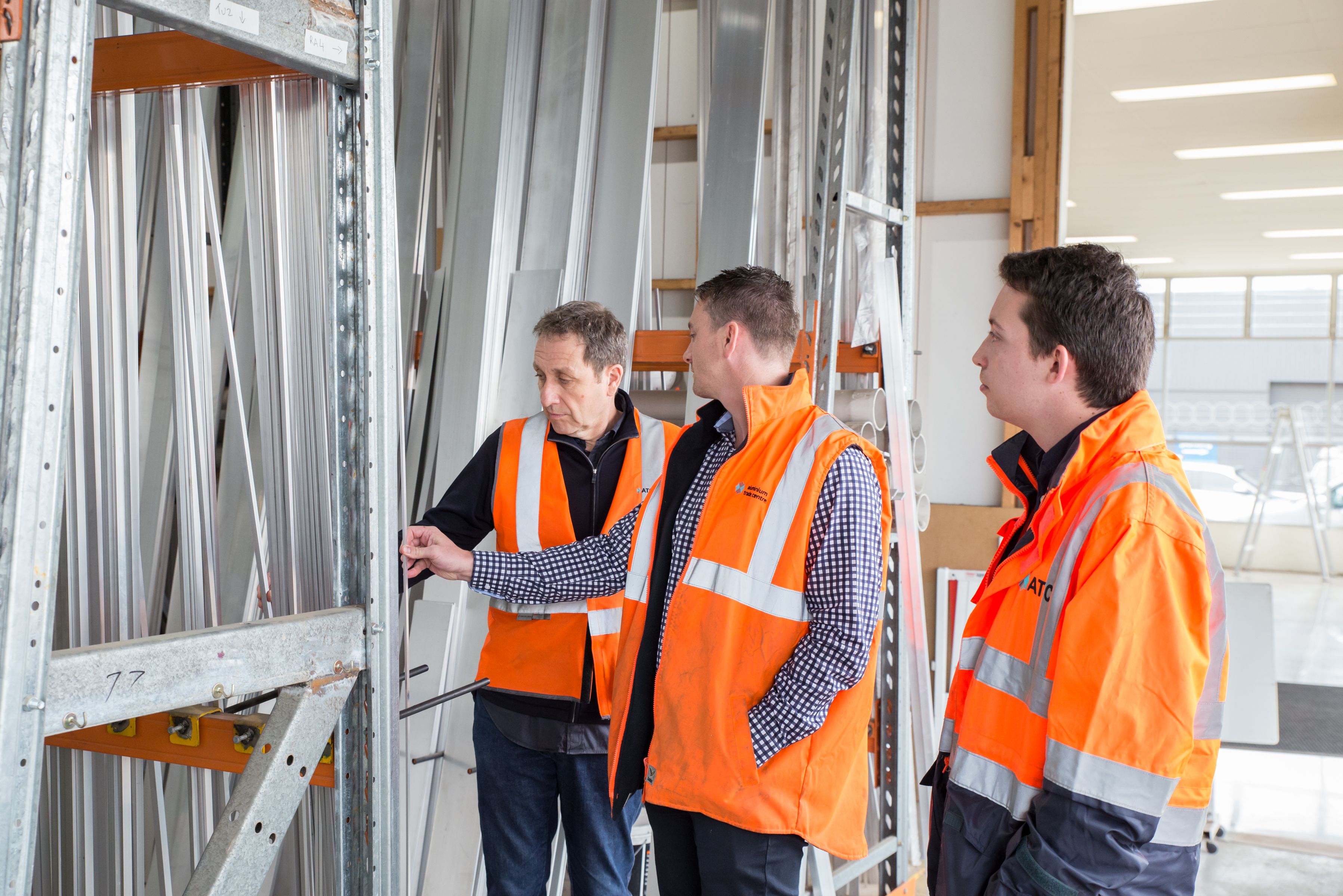 Two independent contractors discussing a building project in a warehouse, emphasizing the need for business continuity