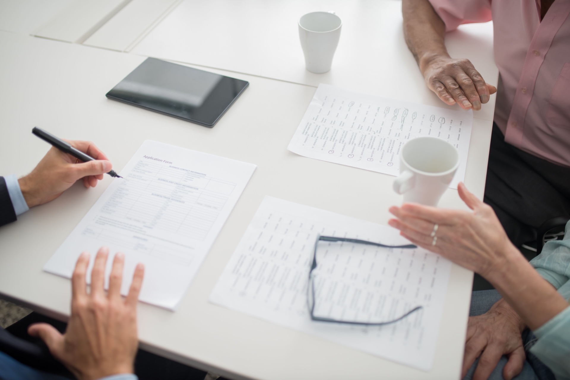 Health insurance adviser discussing underwriting options with clients
