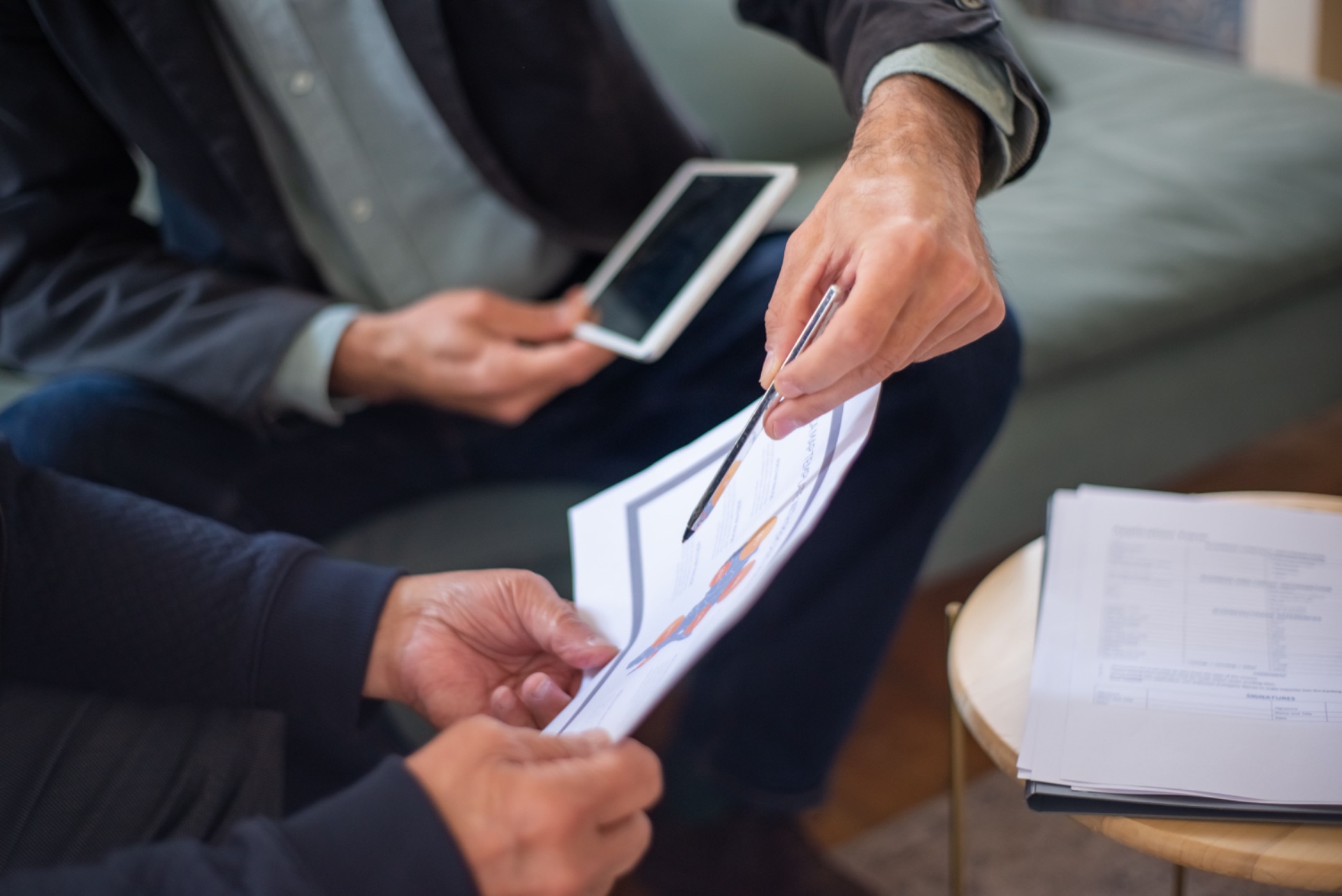 Adviser reviewing health insurance documents with client
