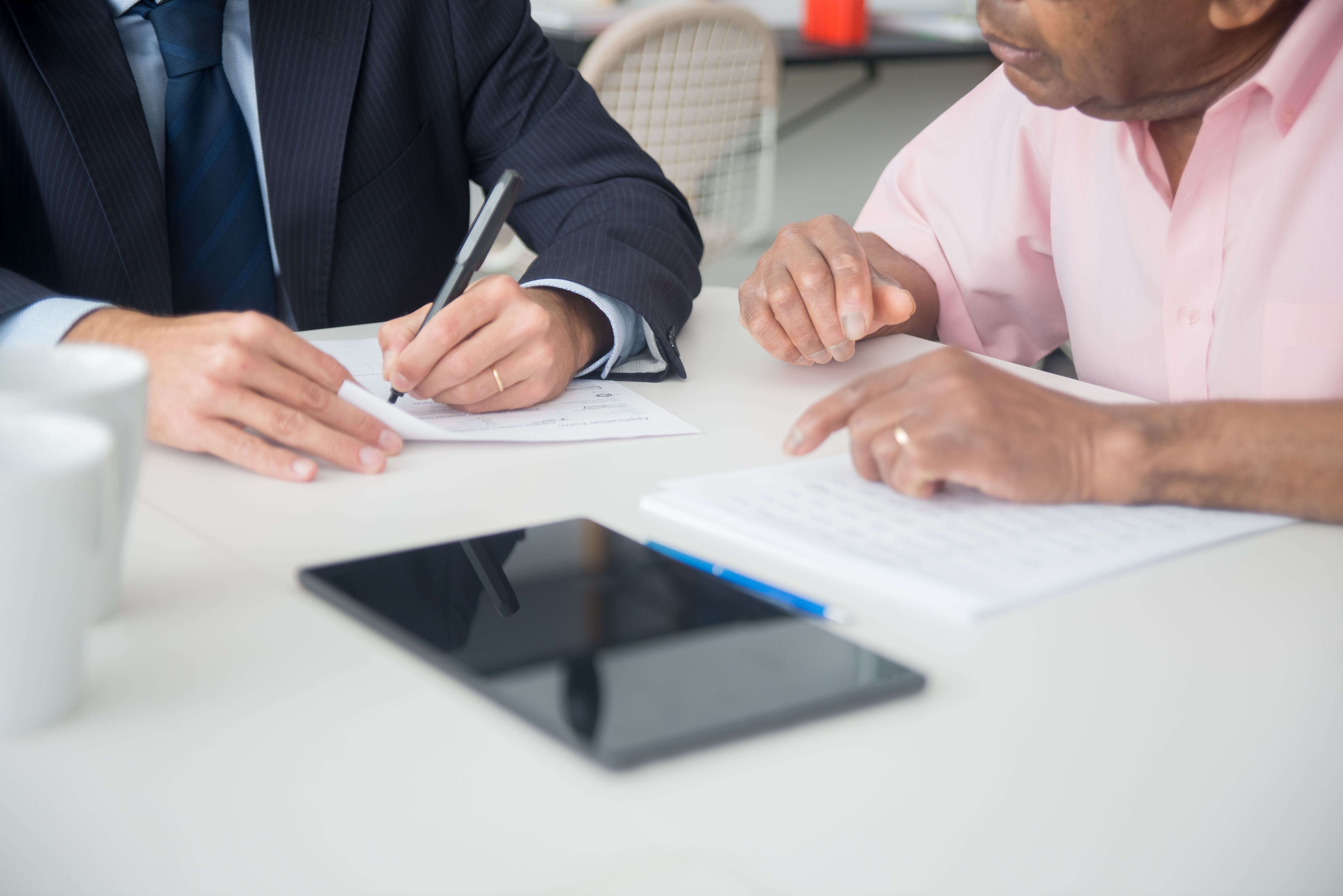 Adviser discussing health insurance options with a client